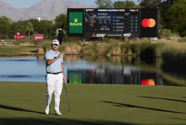 Patrick Cantlay posing with a trophy after winning a golf tournament
